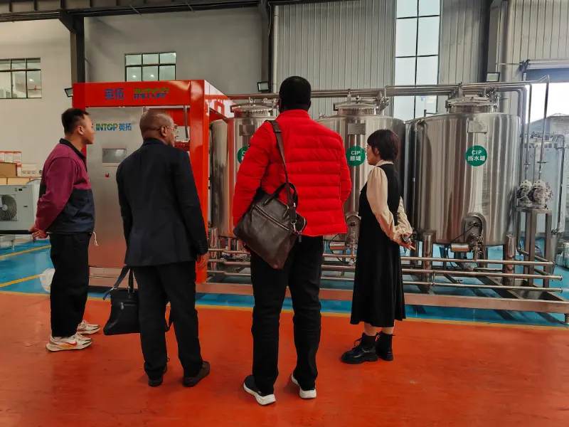 INTOP estabelece com sucesso linha de produção de bebidas com água purificada na Tanzânia